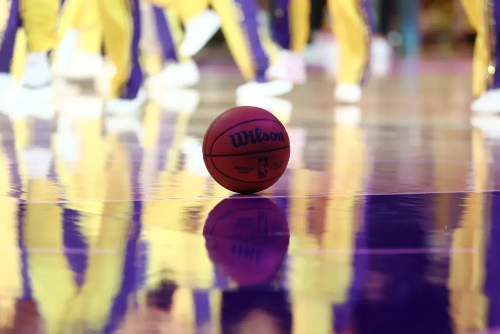 A basketball sits on the court during the second half...