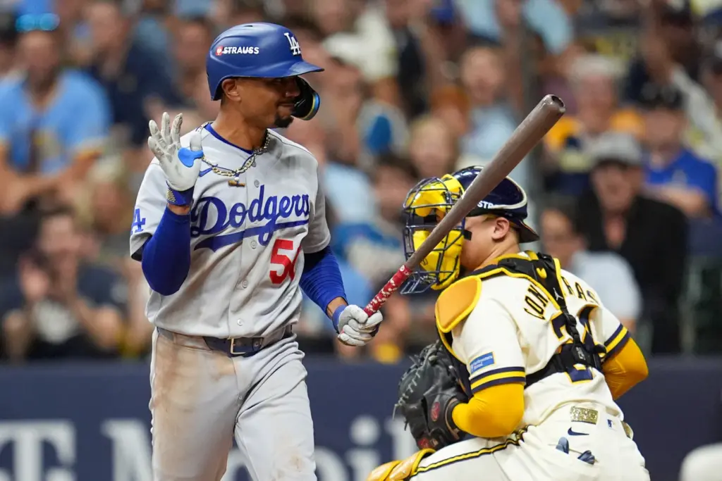 The Dodgers’ Mookie Betts shows his frustration as he walks...