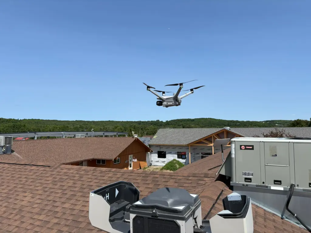 A drone takes off from a nesting station on the roof of Wiikwemkoong's civic complex.