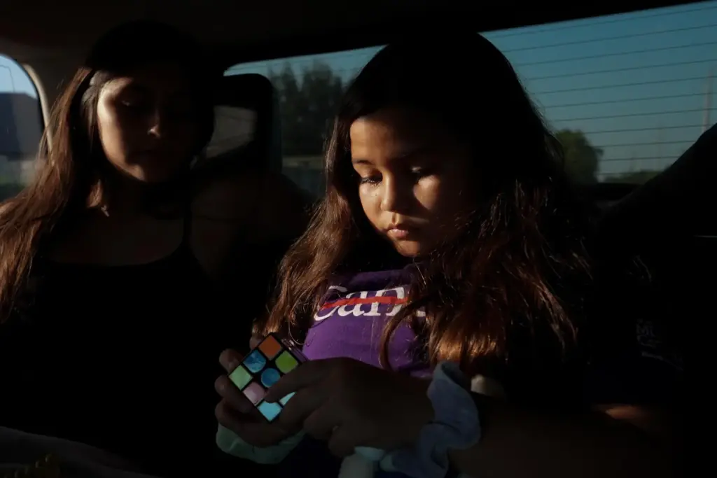 Kathryn Shergold, right, solves a Rubik’s Cube in the car...