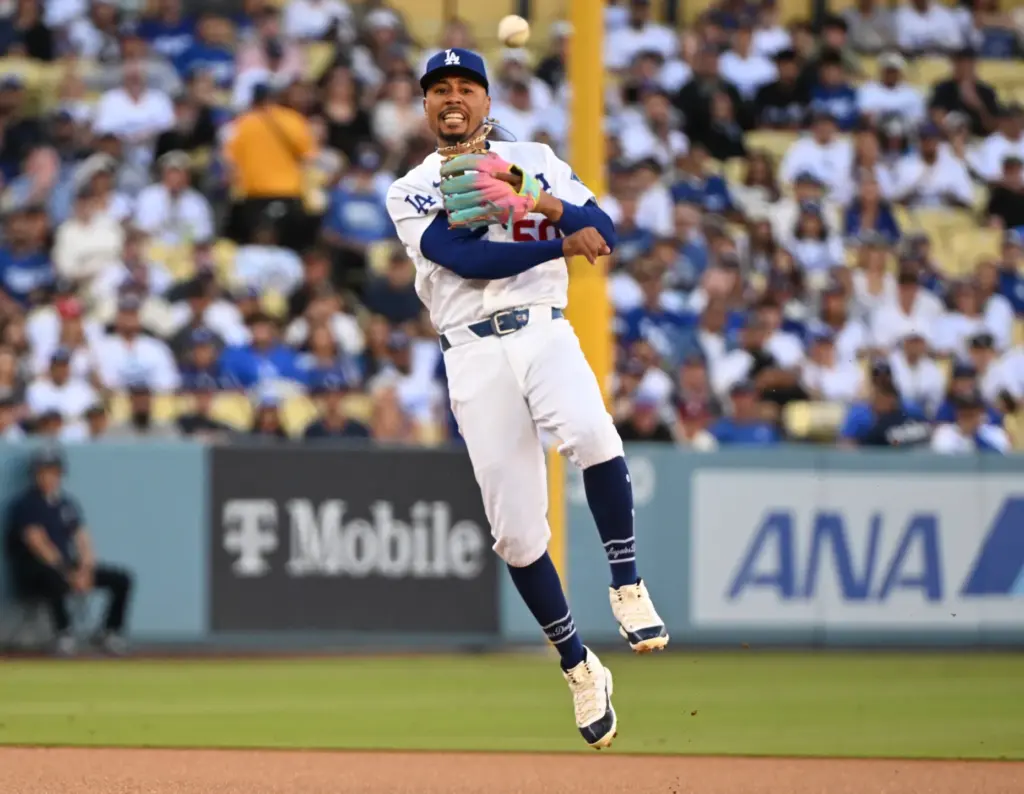 Dodgers shortstop Mookie Betts throws out the Milwaukee Brewers’ Jackson...