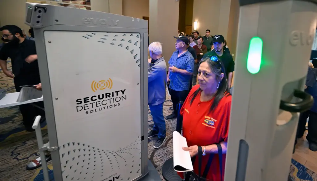 Elizabeth Alvarez waits her turn to go through a metal...