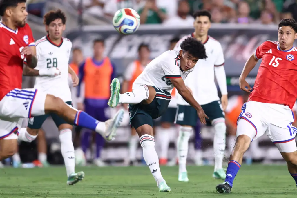 Mexico forward Isaias Violante Romero (26) kicks the ball up...