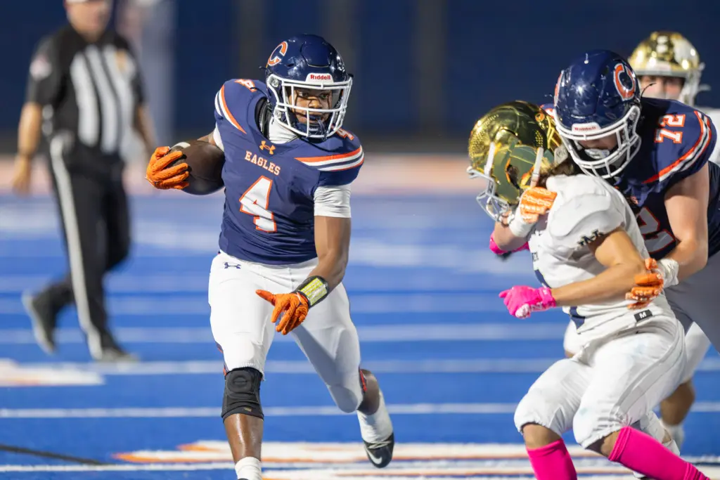 Chaminade High Schoolâs Marquis Jones (4) carries the ball as...