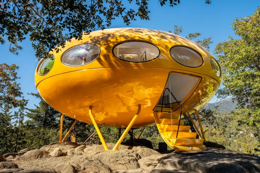 The harvest-gold Donaldson Futuro house sits with its retractable airplane-hatch...