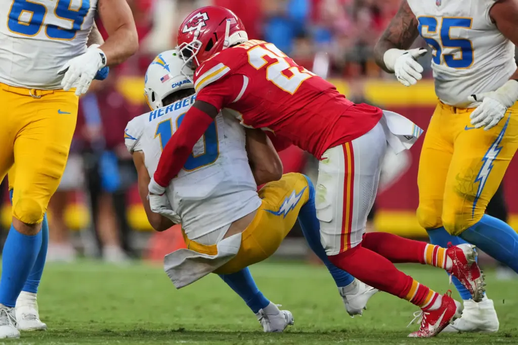 Kansas City Chiefs safety Chamarri Conner (27) sacks Chargers quarterback...
