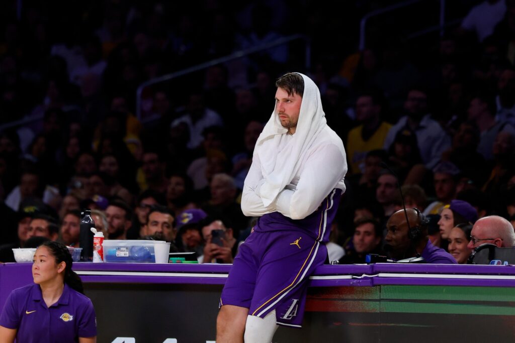 Lakers star Luka Doncic stands on the sideline waiting to...