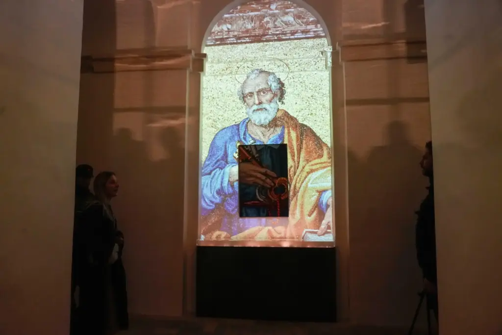 FILE – An image of St. Peter is projected on...