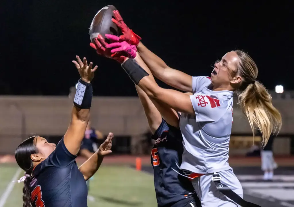 Huntington Beach defenders Shelby Nguyen (3), left, and Emma Bernacchi...