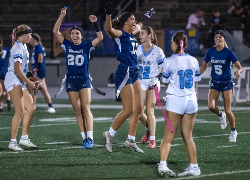Newport Harbor players celebrate their victory over Corona del Mar...