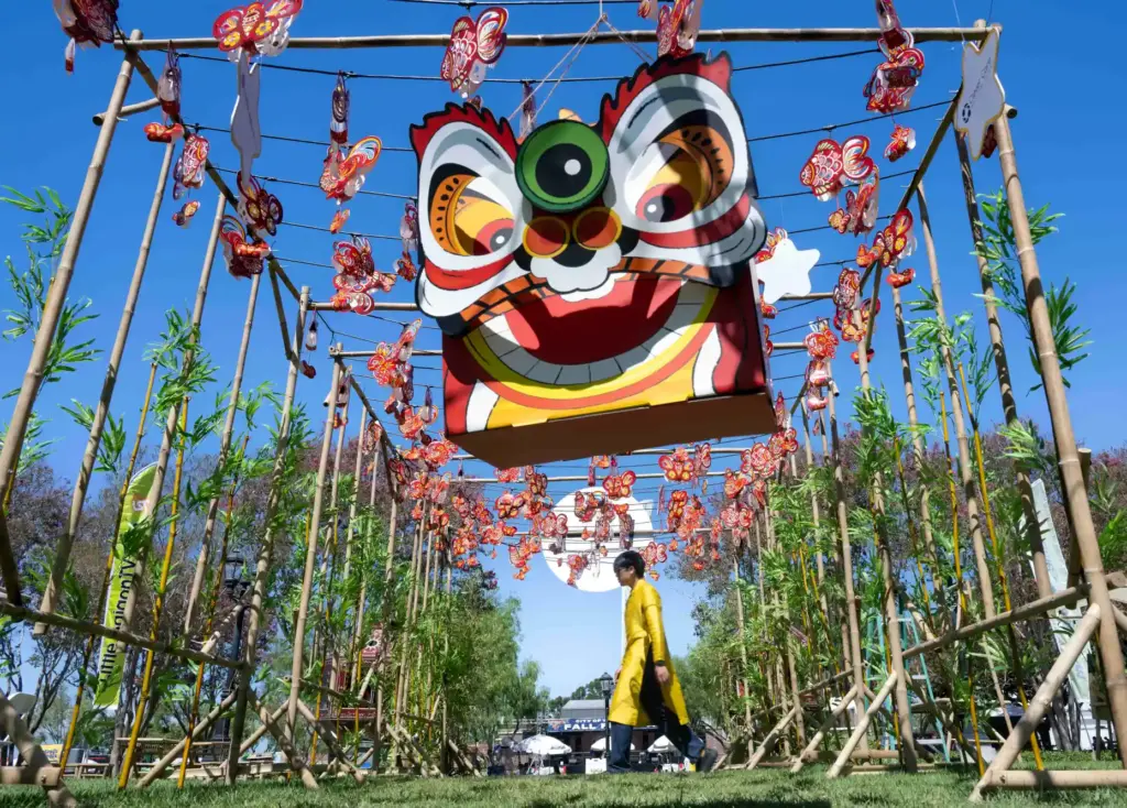 Peter Tran walks through the lantern garden at the fifth...