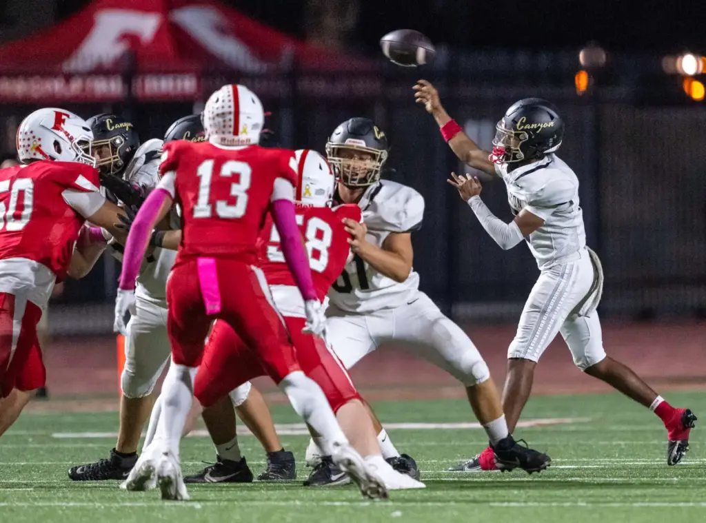 Canyon quarterback Kayden Phillips (5) throws the ball during a...