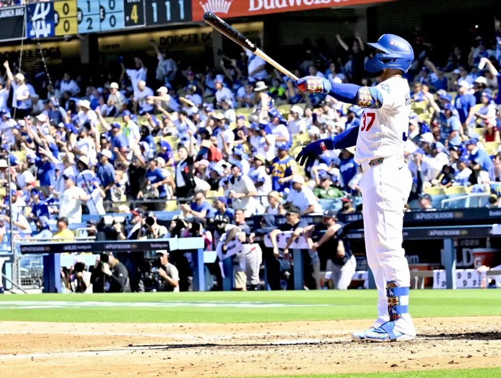 The Dodgers’ Teoscar HernÃ¡ndez watches the flight of his two-run...