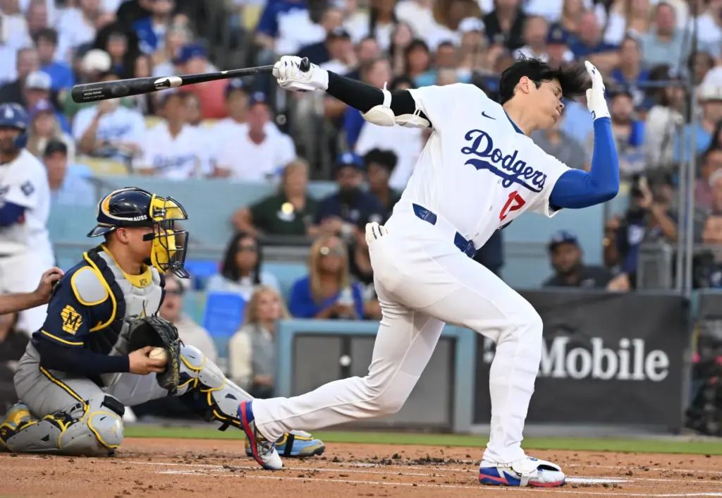 Dodgers star Shohei Ohtani loses his helmet as he strikes...