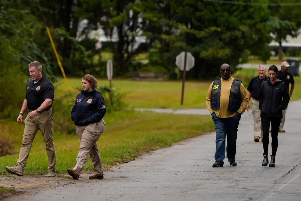 Authorities investigate the scene of a mass shooting in Vienna, Georgia.