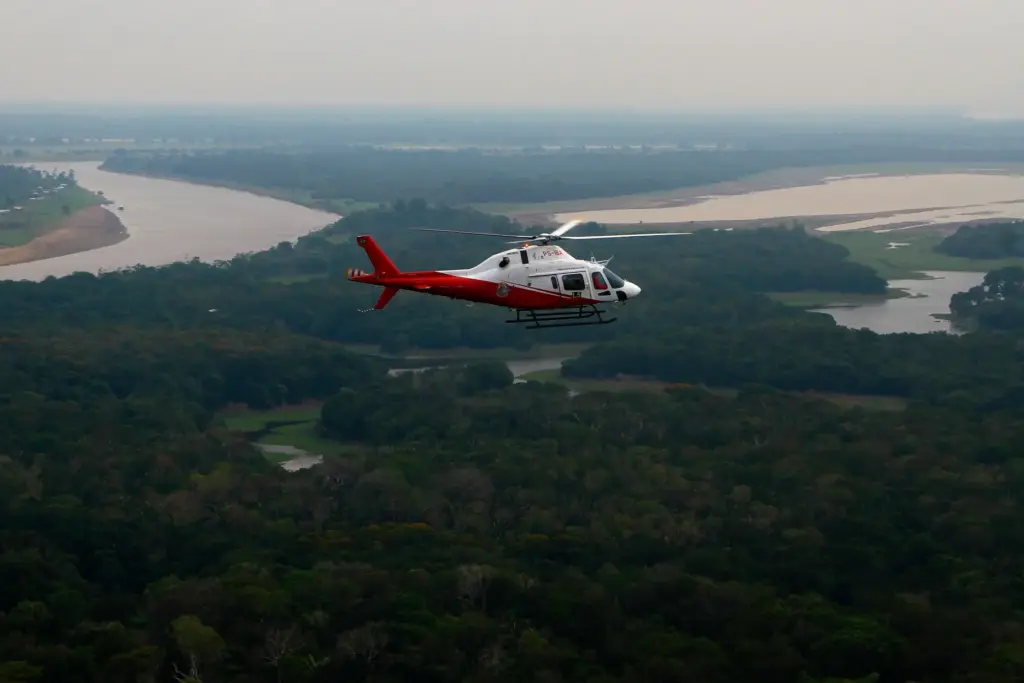 FILE – A helicopter from Brazil’s environmental agency flies over...