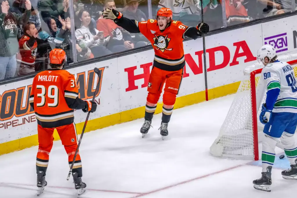 Ducks players Jeff Malott, left, and Leo Carlsson celebrate Carlsson’s...