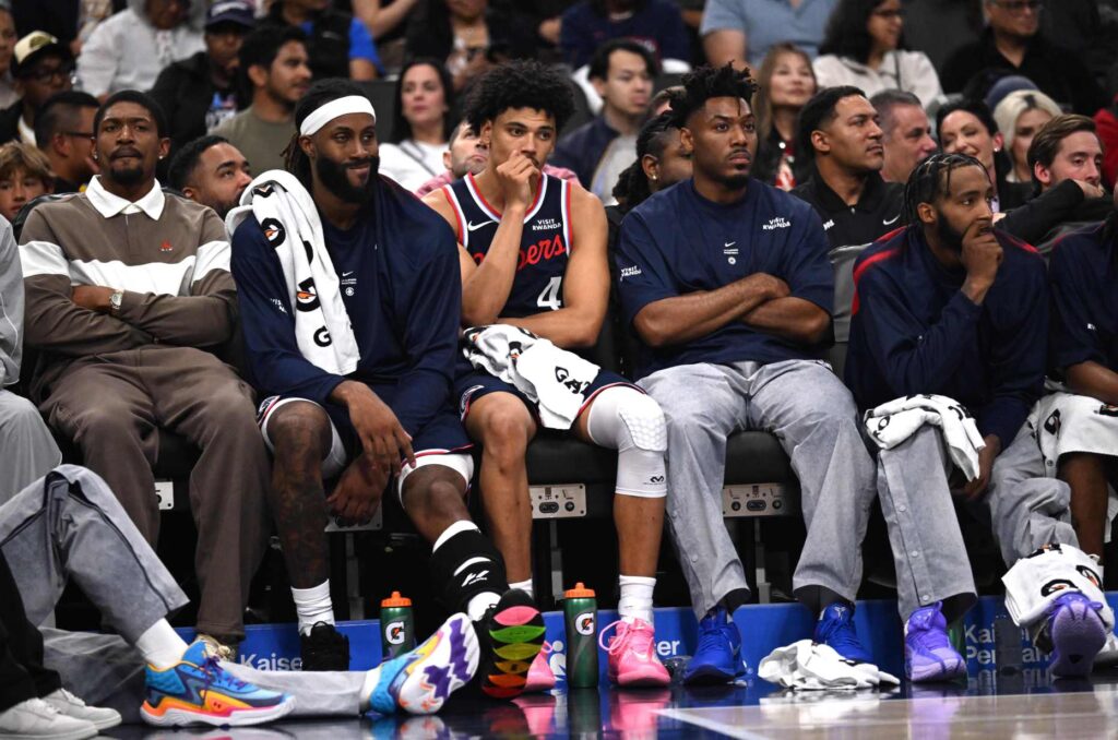 Clippers players, including rookie guard Keaton Wagler, middle, watch from...