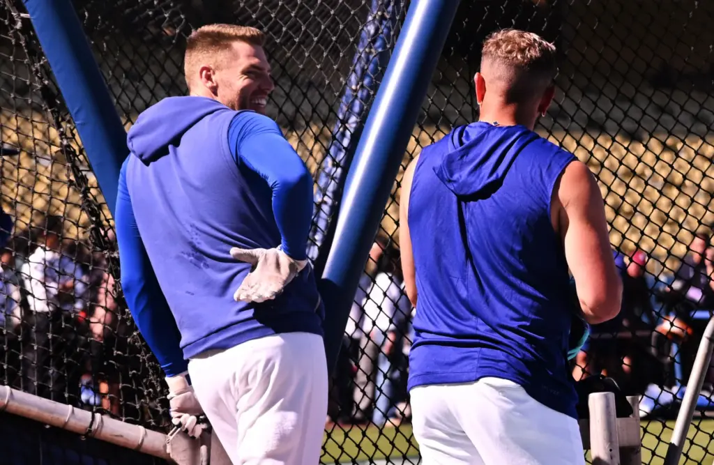 Dodgers first baseman Freddie Freeman, left, and infielder Miguel Rojas...