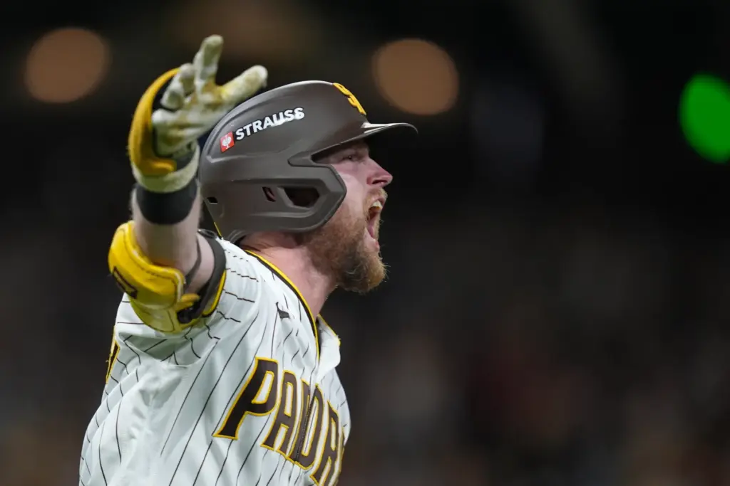 The San Diego Padres’ Jake Cronenworth celebrates as he runs...