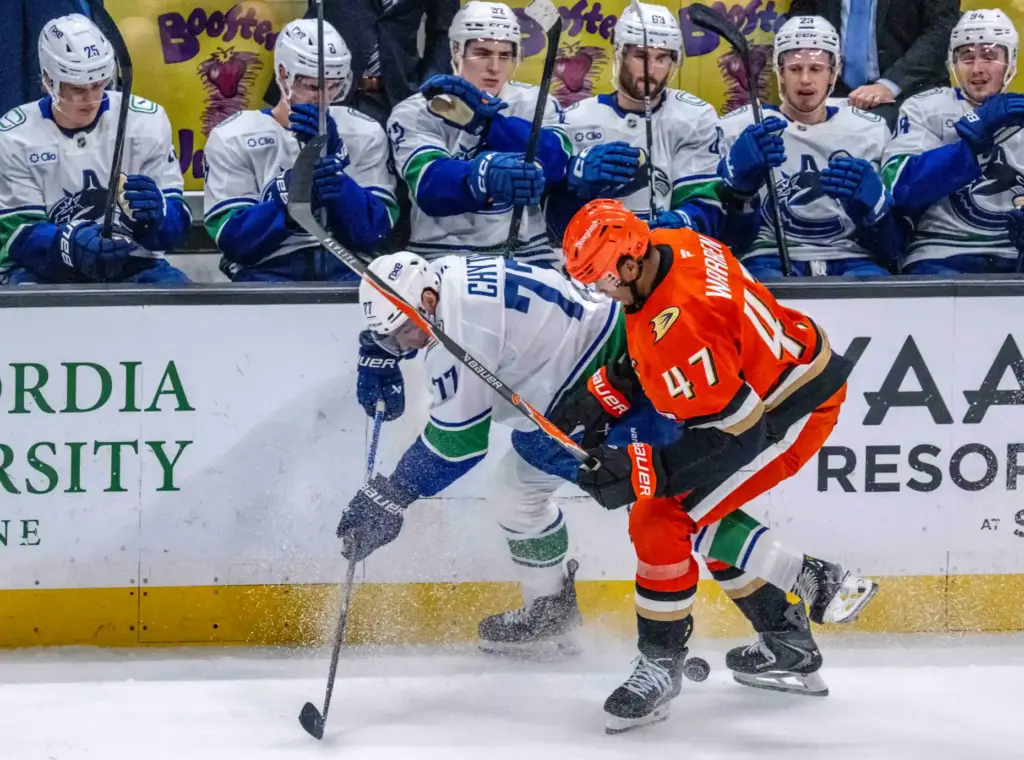 The Vancouver Canucksâ Filip Chytil, left, and the Ducksâ Noah...