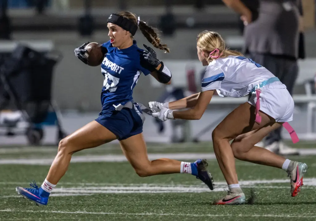 Newport Harbor running back Skylie Cid (33) carries the ball...