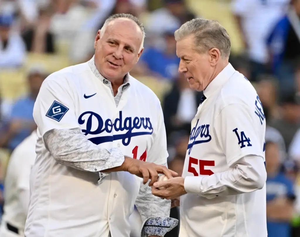 Former Dodger catcher Mike Scioscia, left, and former Dodgers pitcher...