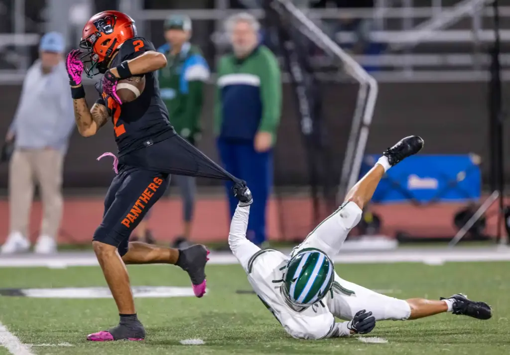 Orange tight end KJ Woodbury (2) breaks a tackle while...