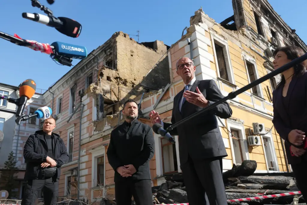 Ukraine’s President Volodymyr Zelenskyy, centre, and German Chancellor Friedrich Merz...