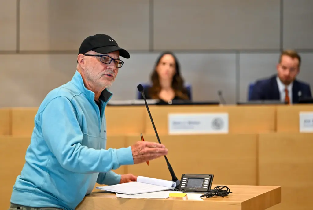 Charles Fancher, Jr., address the Newport Beach city council during...