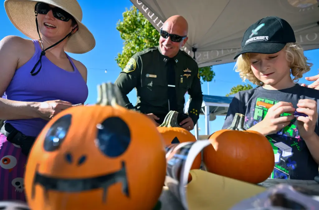 Tanya Jordan, left, Orange County Sheriffâs Department Captain Bill Burk,...