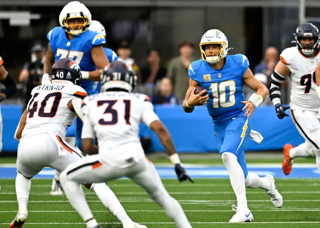 Chargers quarterback finds little running room against the Denver defense...