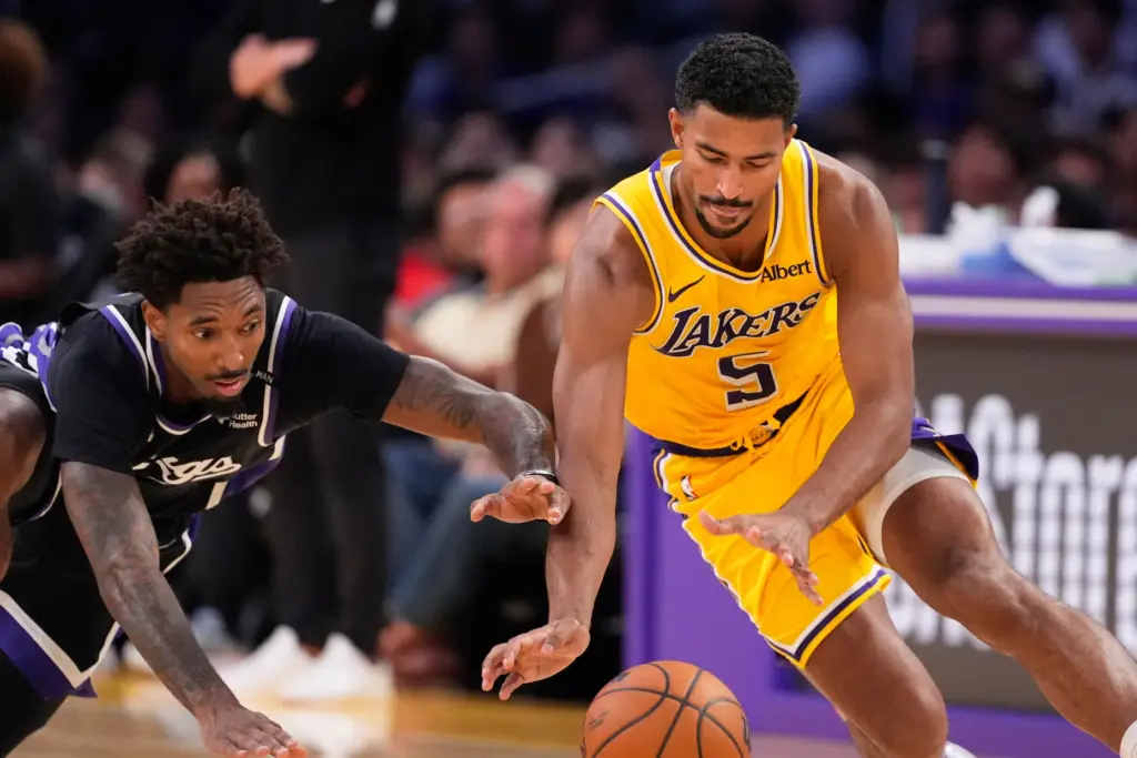 Sacramento Kings forward Leaky Black, left, and Lakers guard Quentin...