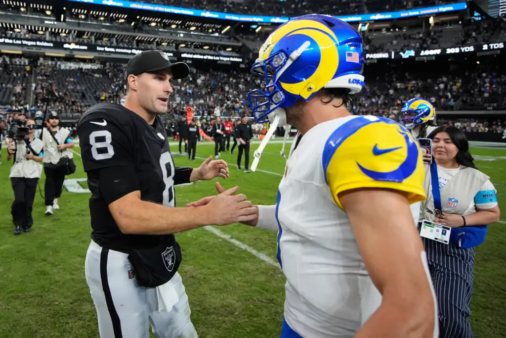 Las Vegas Raiders quarterback Kirk Cousins (8) talks to Rams...