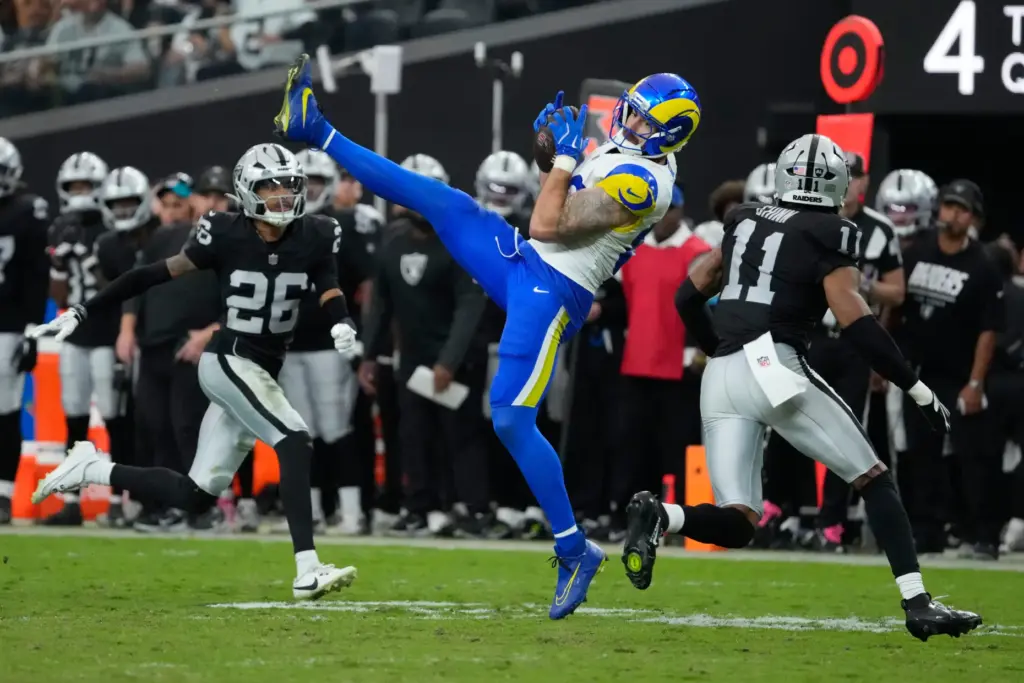 Rams tight end Tyler Higbee, center, makes a catch against...