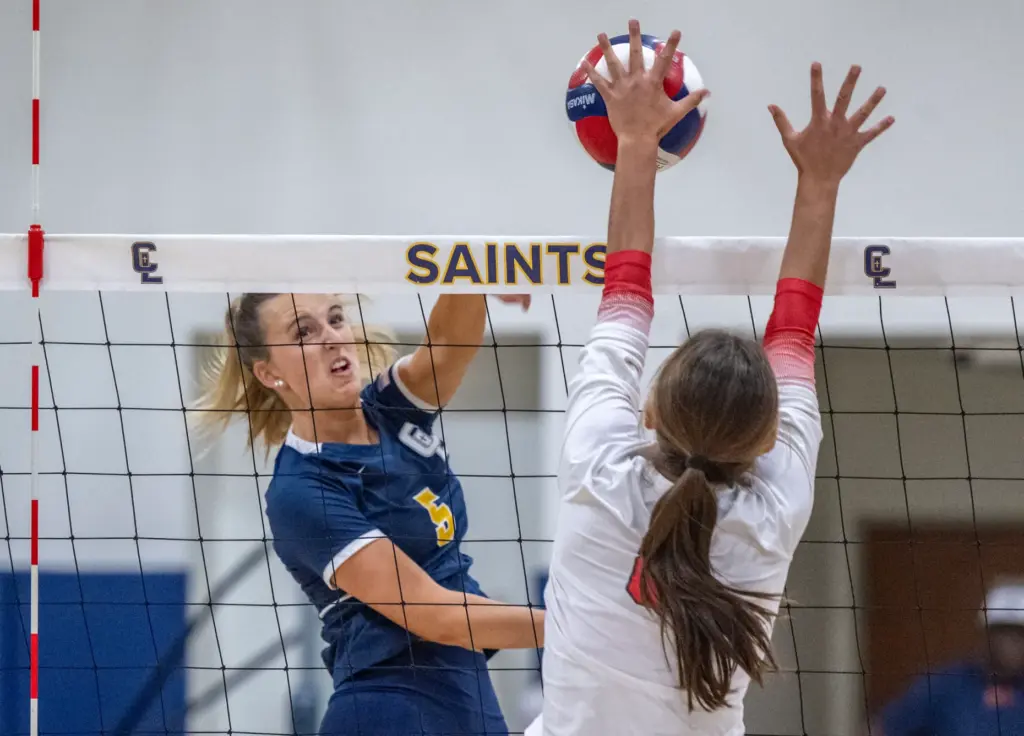 Crean Lutheran opposite hitter Brooke Badorek (5) hits the ball...