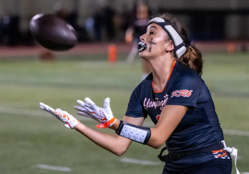 Huntington Beach wide receiver Brianna Massion (2) catches a punt...