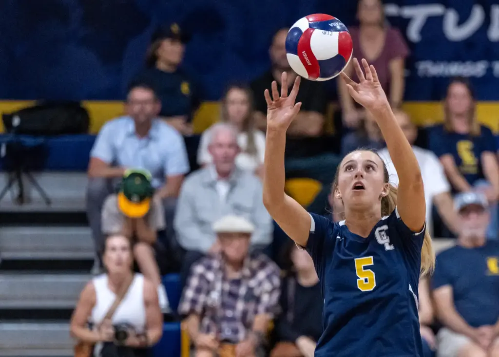 Crean Lutheran setter Brooke Badorek (5) sets the ball during...