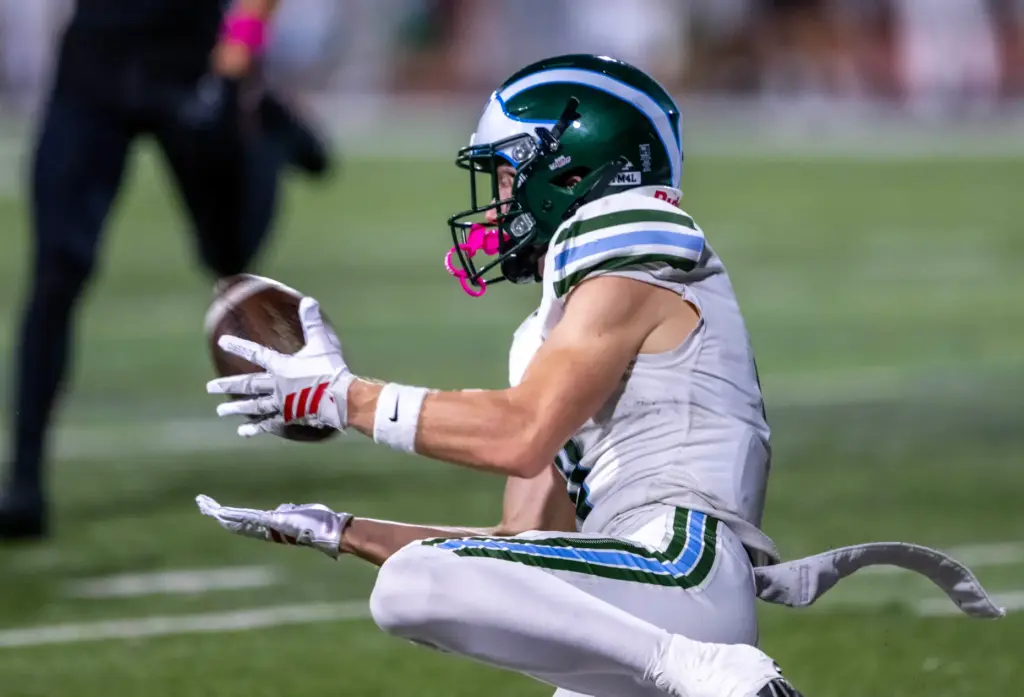 Irvine wide receiver Kyle Fogarty (0) makes a sliding touchdown...