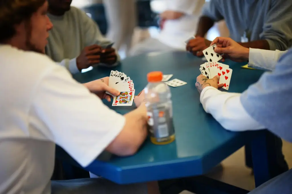 People who are incarcerated play cards at a Minnesota Correctional...
