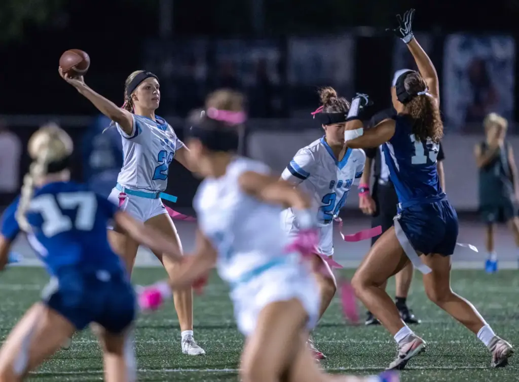 Corona del Mar quarterback Charlotte Ring (26) throws the ball...
