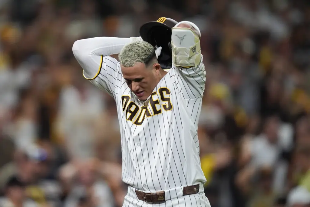 The San Diego Padres’ Manny Machado reacts after he flied...