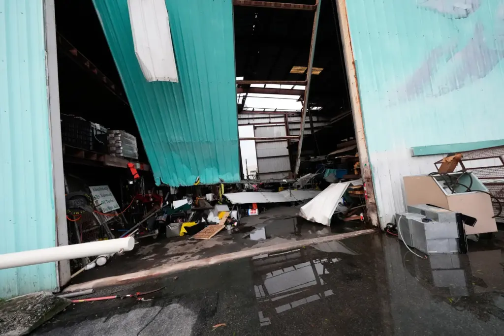 Damage to a warehouse owned by A.J.’s Restaurant is seen...