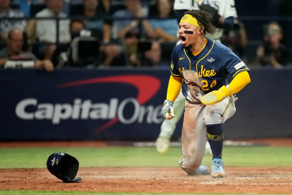The Milwaukee Brewers’ William Contreras celebrates after scoring during the...