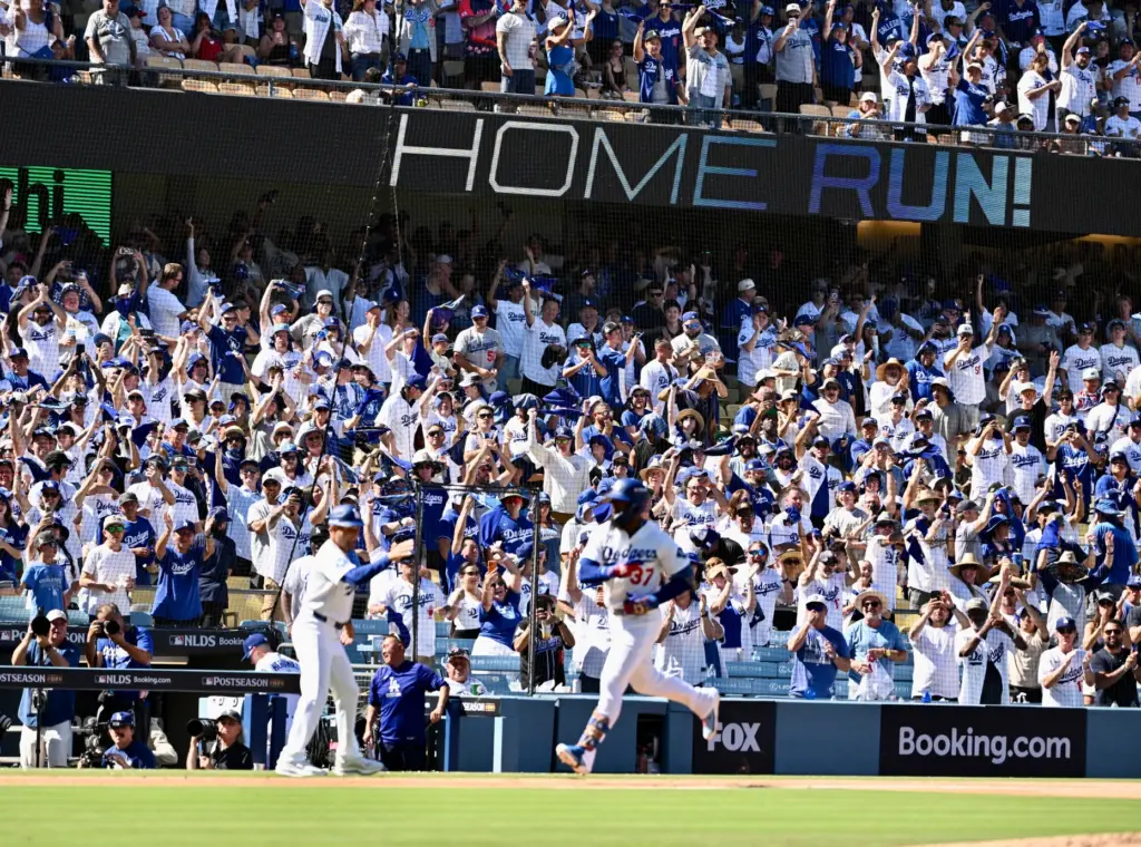 The Dodgers’ Teoscar HernÃ¡ndez runs the bases after hitting a...