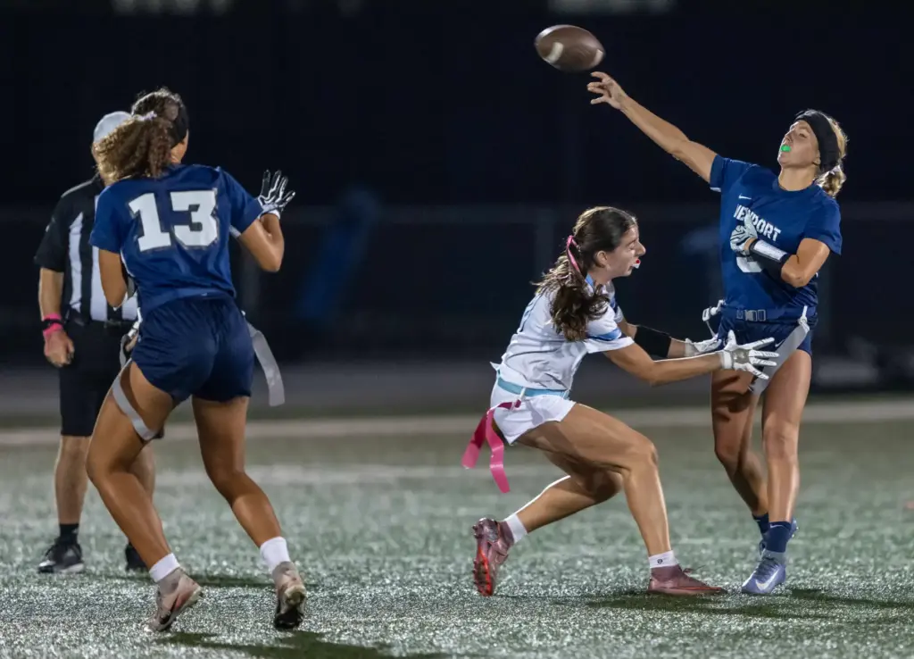 Newport Harbor quarterback Scarlett Guyser (9) throws the ball during...