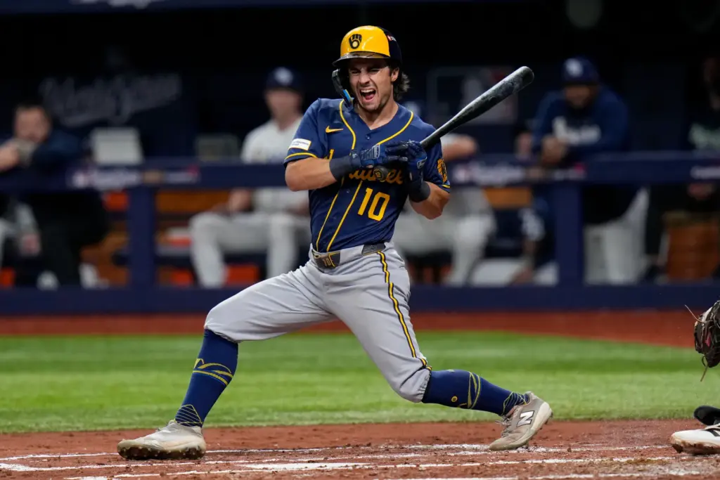 The Milwaukee Brewers’ Sal Frelick reacts after being hit by...