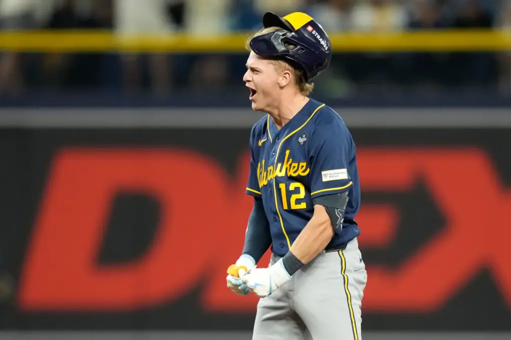 The Milwaukee Brewers’ Cooper Pratt celebrates his RBI double during...