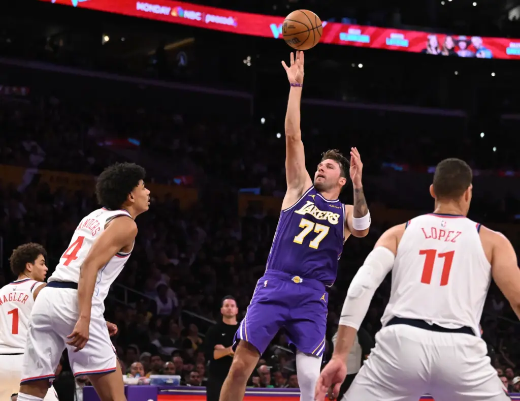 Lakers star Luka Doncic takes a shot in front of...