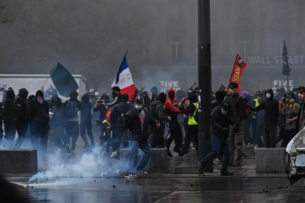 EDS NOTE: OBSCENITY – Protesters confront police during a demonstration...